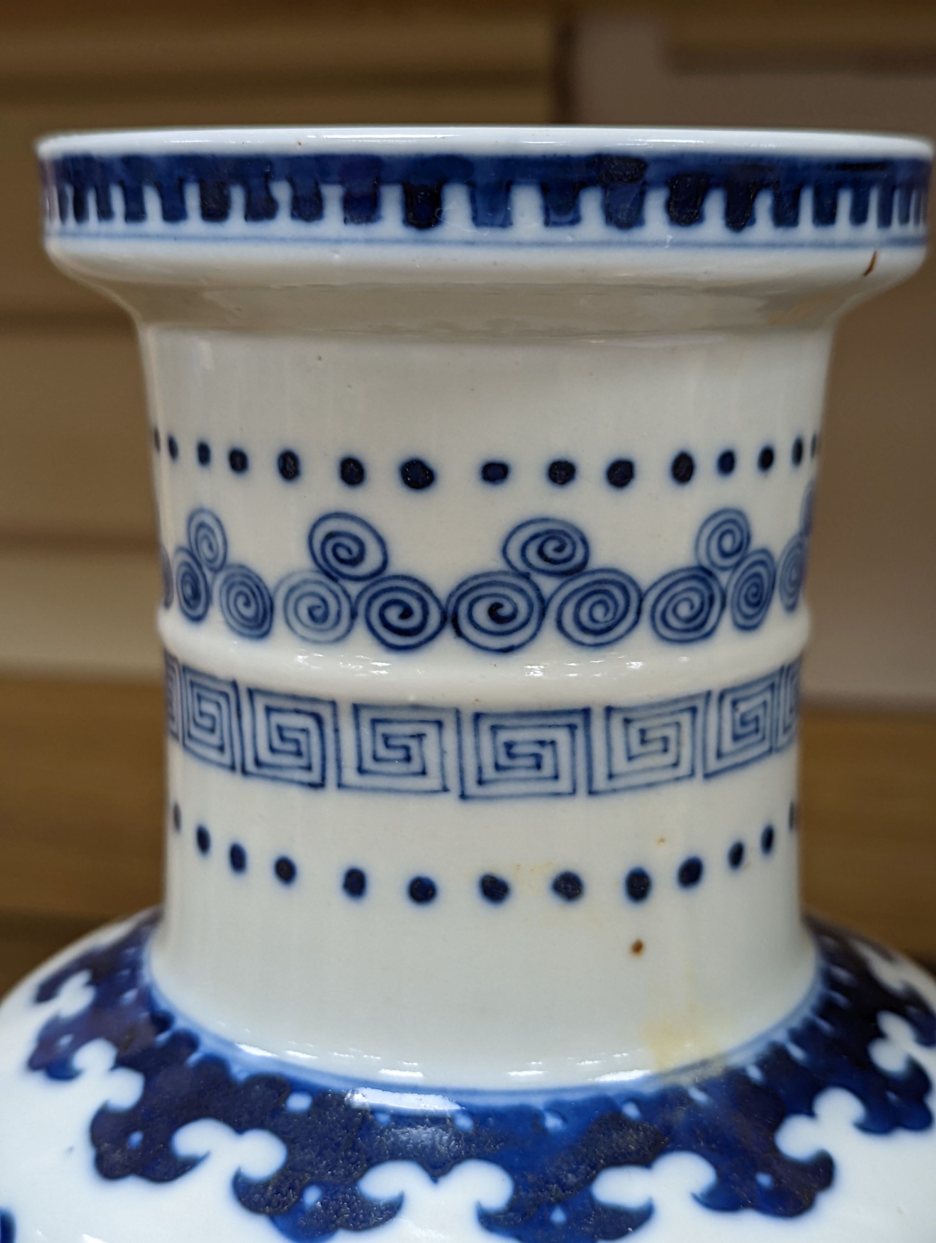 A Chinese blue and white rouleau vase, 35 cms.